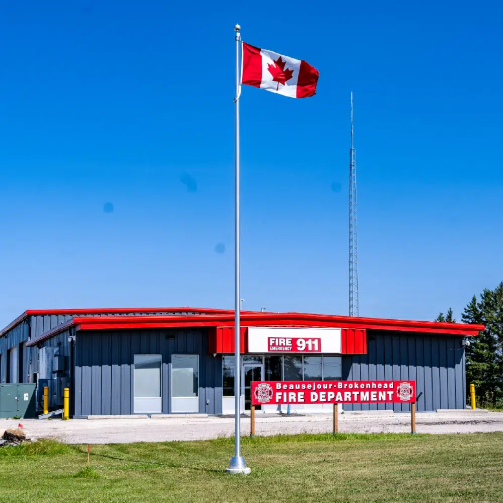 New Ewing flagpole installation at the Fire hall in Beausejour Manitoba, flying a Canadian flag